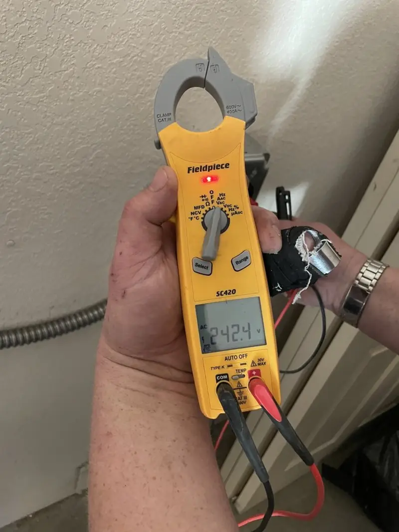 Voltage testing with clamp meter during Whole House Surge Protector in Lansdowne